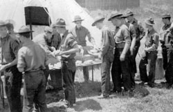 Soldiers in the chow line cir. 1933 at Camp Edwards.